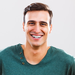 Adult Male Smiling with Braces from orthodontist at Sullivan Bastian Orthodontics in Mill Creek, WA